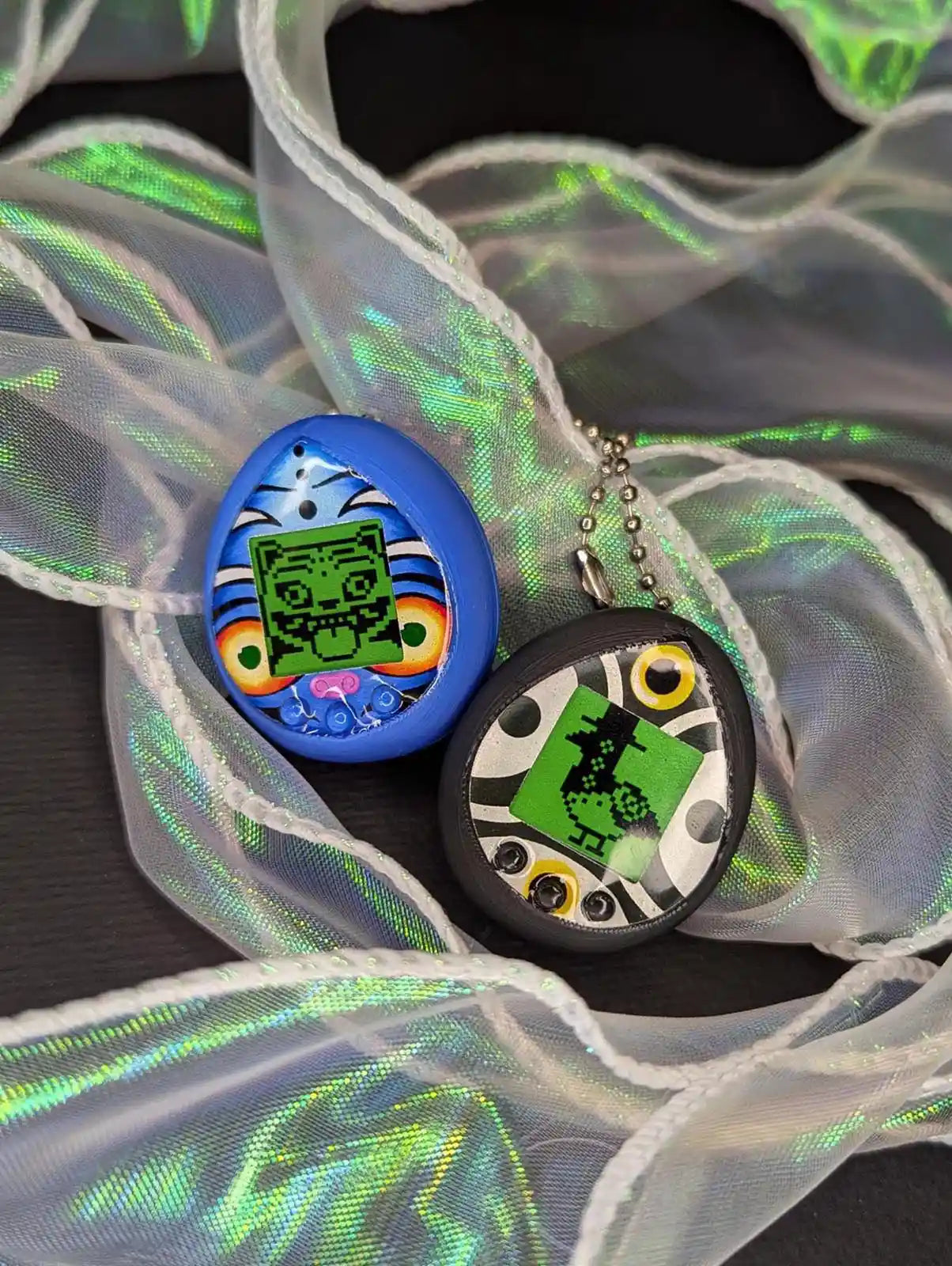 K-Pop Demon Hunters · Derpy & Sussie Tamagotchi Keychain